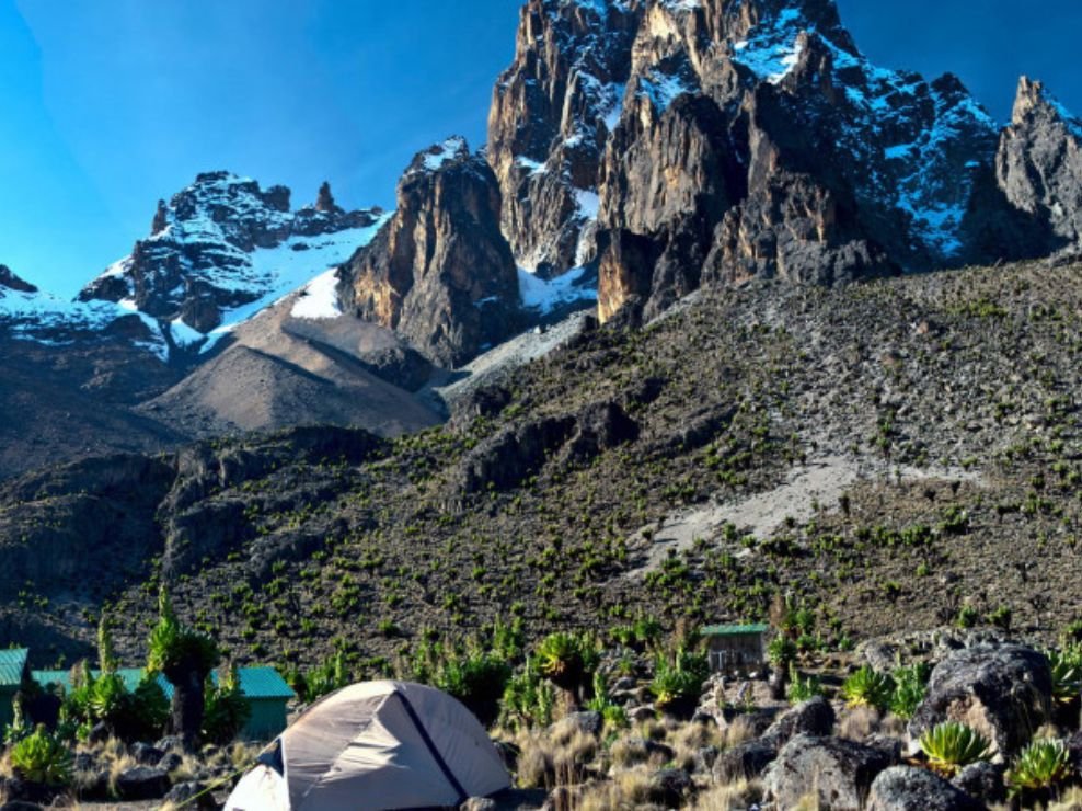 Jagged peaks of Mount Kenya including Batian, Nelion, and Point Lenana under clear skies during the Chogoria to Sirimon Route trek